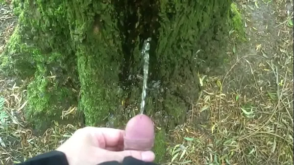 Show Man pissing on a tree power Tube