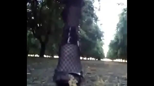 Show Crossdresser Walking in the almond orchard power Tube