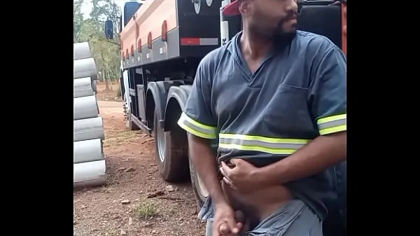 Pokaż Worker Masturbating on Construction Site Hidden Behind the Company Truck lampę zasilającą